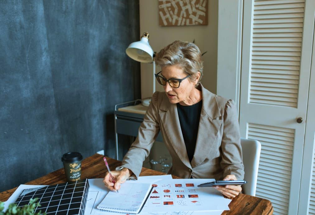 Woman working at desk on investment management